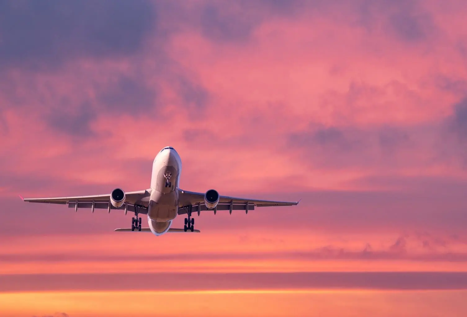 bigstock-Airplane-Is-Flying-In-Colorful-386544625-C