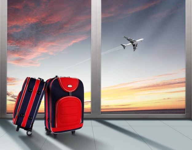 bigstock-Red-suitcase-and-plane-in-the–23274953 Corporate Travel Business Air Travel Luggage